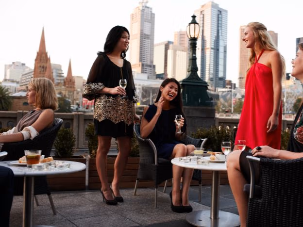 Drinks at Melbourne rooftop bar credit Tourism Australia