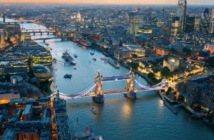 Tower Bridge and the London skyline illuminated at dusk